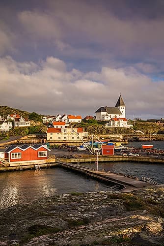 Sweden-Bohuslan-Tjorn Island-Skarhamn-town skyline with Skarhamn church-sunset Coastal Print